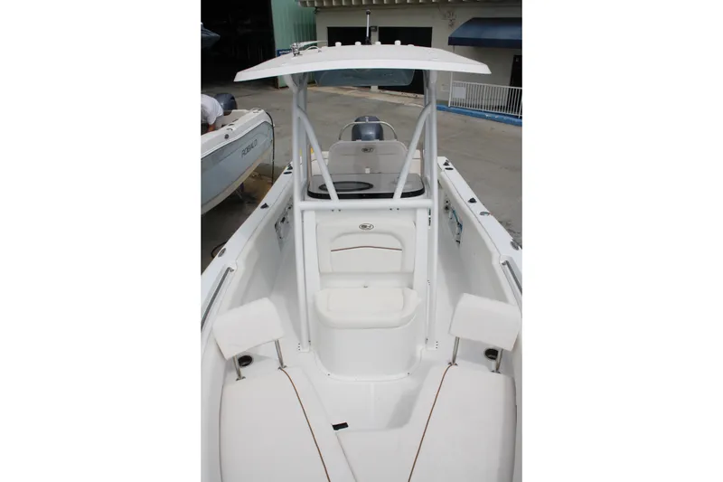 Slide: The Image of 2022 Sea Hunt Ultra 219 boat interior with seating and console. - 16