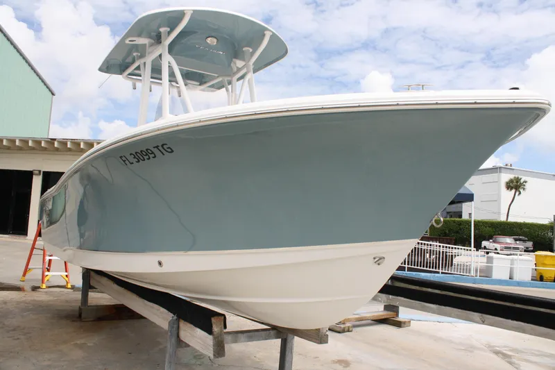 Slide: The Image of 2022 Sea Hunt Ultra 219 boat on display, showcasing sleek design and modern features. - 2