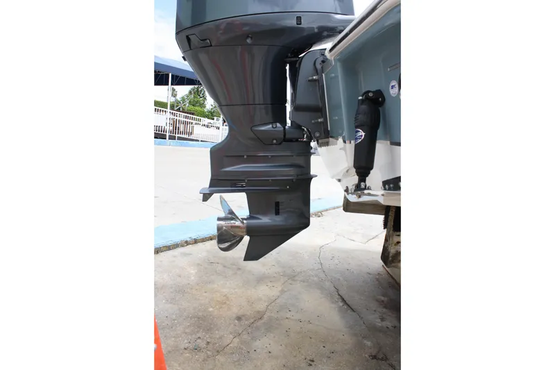 Slide: The Image of Outboard motor of 2022 Sea Hunt Ultra 219 boat, showcasing propeller and engine details. - 33
