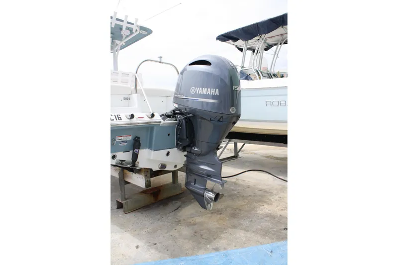 Slide: The Image of 2022 Sea Hunt Ultra 219 boat with Yamaha outboard motor on display. - 5