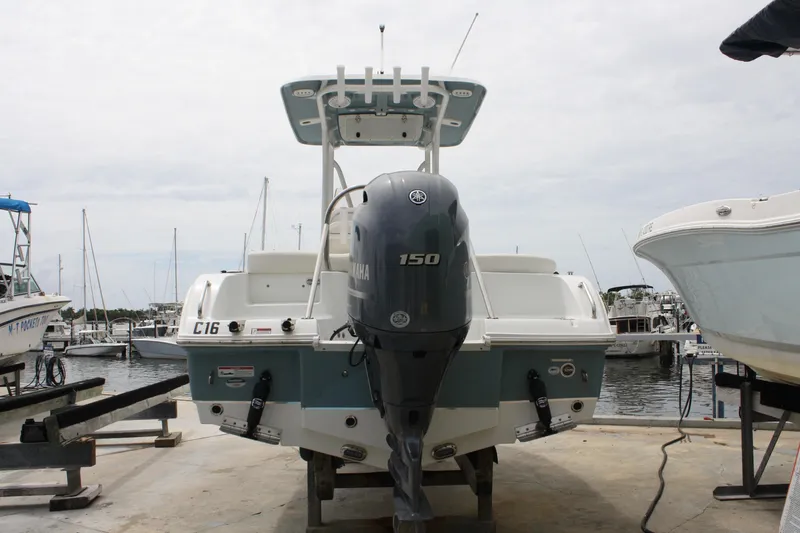 Slide: The Image of 2022 Sea Hunt Ultra 219 boat with Yamaha 150 engine at marina dock. - 7