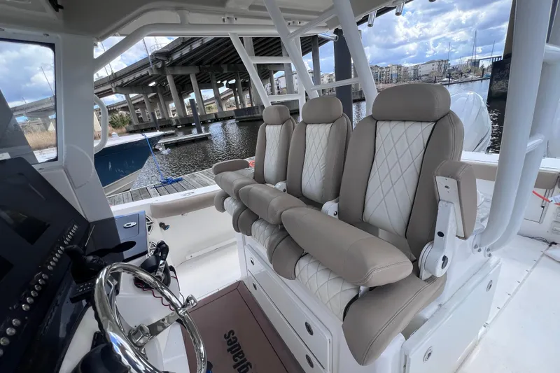 Slide: The Image of Interior of 2020 Everglades 365 Center Console boat with luxurious seating and helm view. - 4