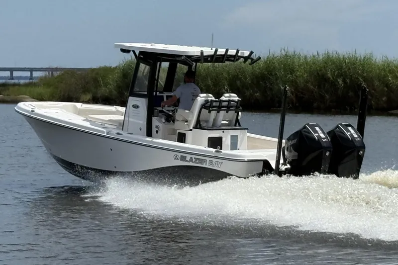 The Image of 2026 Blazer Bay Makaira 2800 boat cruising on water with dual engines. - 0