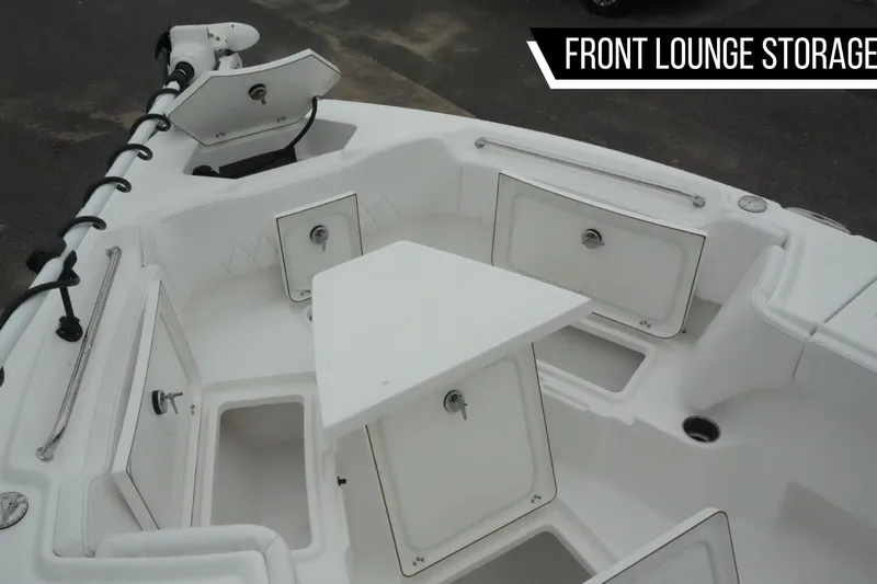 Slide: The Image of 2026 Blazer Bay Makaira 2800 boat with front lounge storage compartments open. - 11