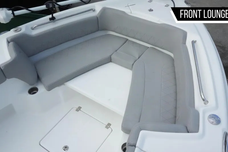 Slide: The Image of Front lounge seating on 2026 Blazer Bay Makaira 2800 boat, featuring gray cushioned seats. - 6