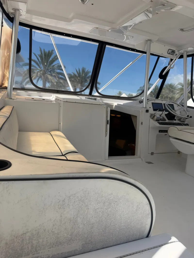 Slide: The Image of Interior of a 1998 Luhrs Open yacht with seating area. - 10