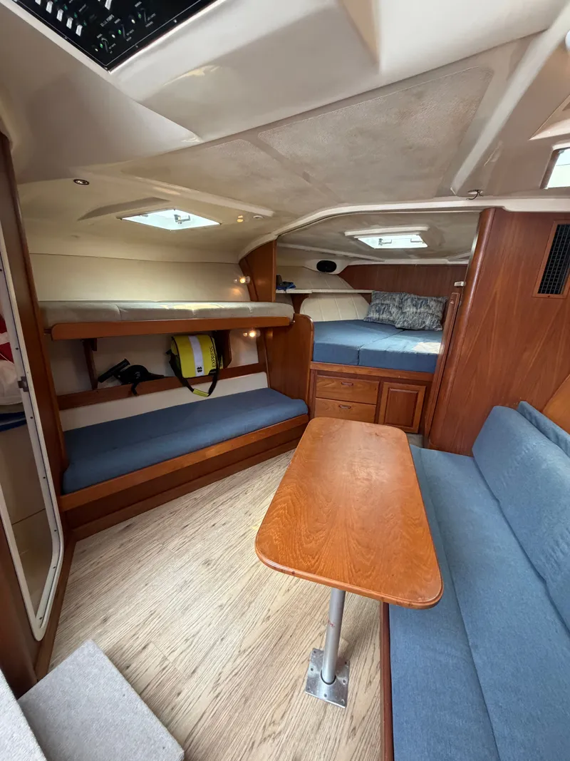 Slide: The Image of Interior of a 1998 Luhrs Open yacht with wooden furnishings. - 11