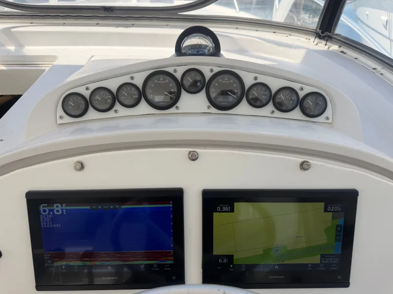 Slide: The Image of Dashboard of a 1998 Luhrs Open boat with Garmin displays. - 2