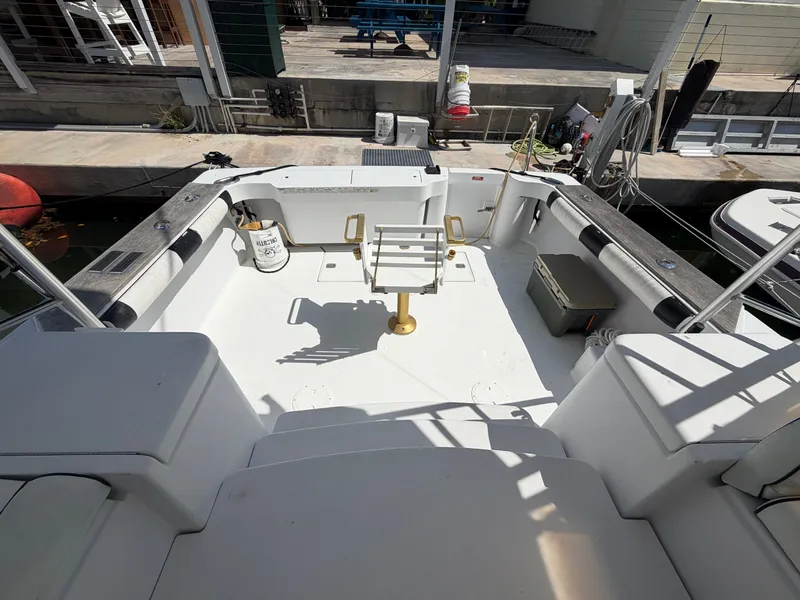 Slide: The Image of 1998 Luhrs Open boat cockpit at the dock. - 3