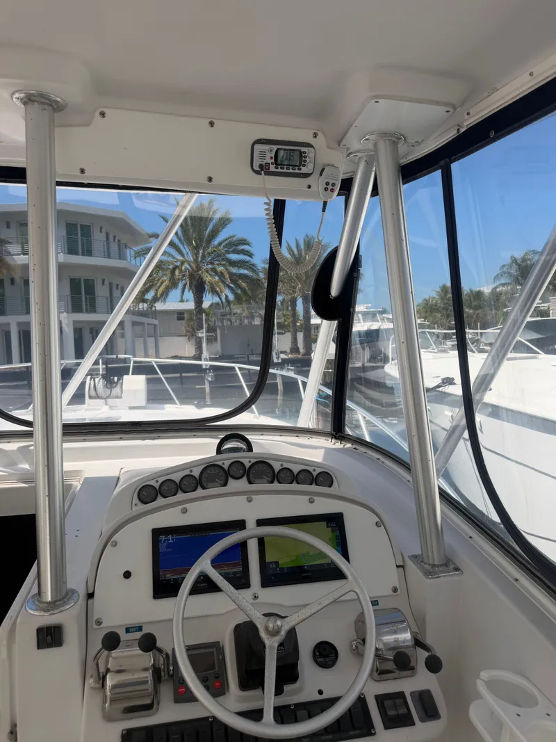 Slide: The Image of Interior view of 1998 Luhrs Open boat cockpit with controls. - 4
