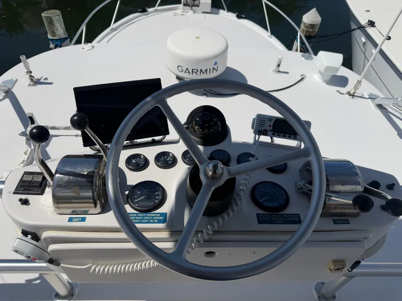 Slide: The Image of 1998 Luhrs Open boat helm with Garmin equipment. - 5