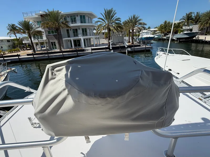 Slide: The Image of Covered helm on a 1998 Luhrs Open boat docked at marina. - 7