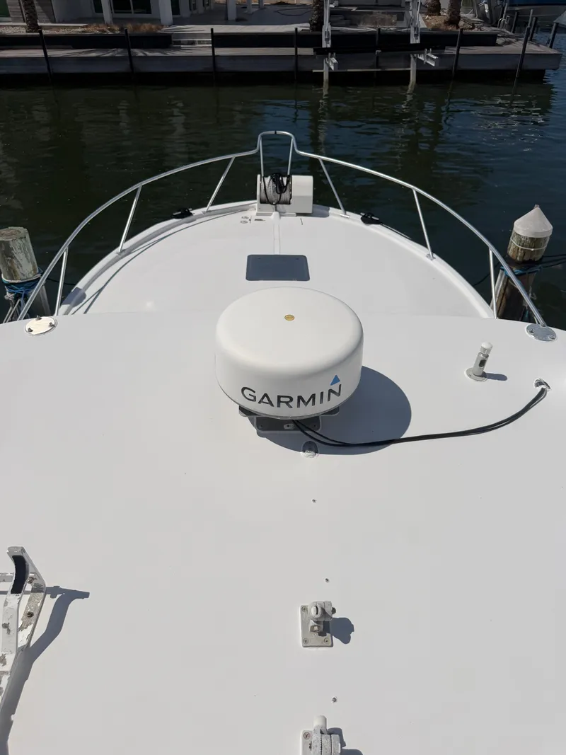 Slide: The Image of 1998 Luhrs Open boat with Garmin equipment at dock. - 8