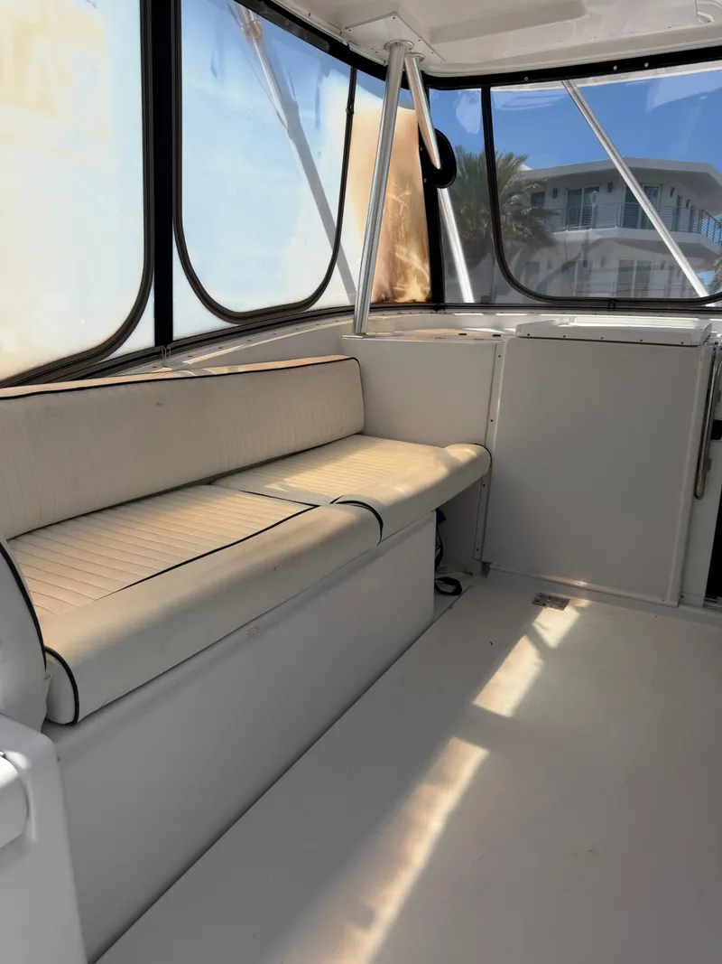 Slide: The Image of Interior of a 1998 Luhrs Open boat with seating area. - 9