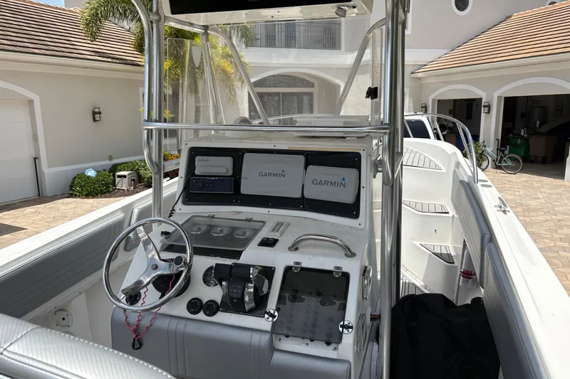 Slide: The Image of 2001 Fountain 31 Center Console boat with Garmin navigation system in a driveway. - 3