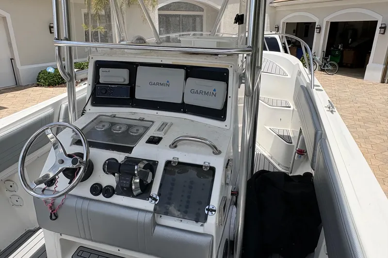 Slide: The Image of 2001 Fountain 31 Center Console boat with Garmin navigation system and sleek interior design. - 4