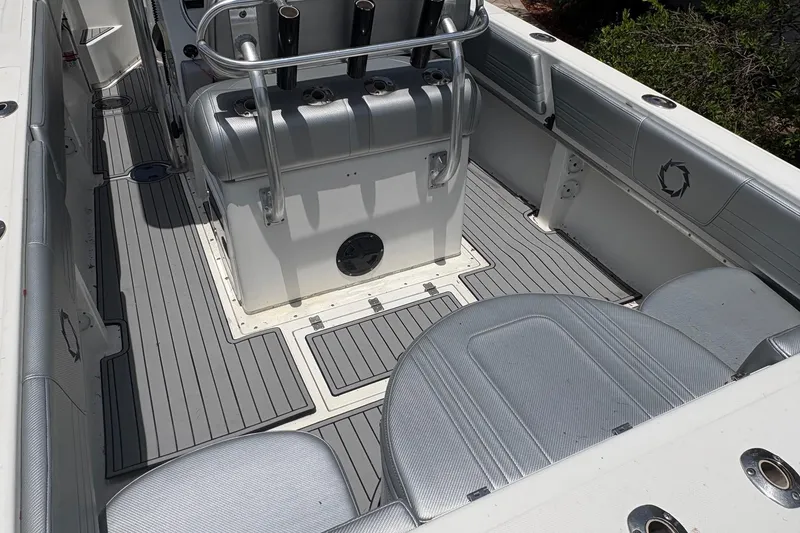Slide: The Image of 2001 Fountain 31 Center Console boat interior with gray seating and flooring. - 7