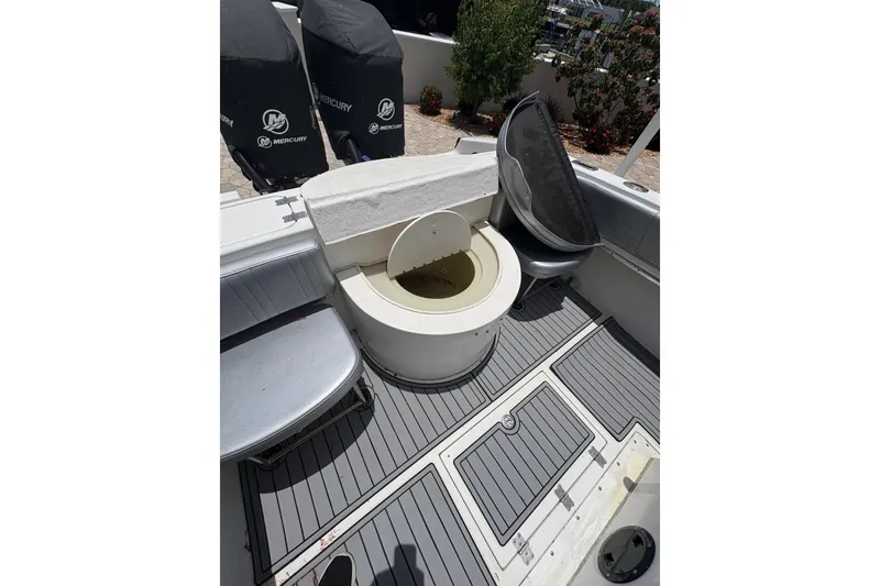 Slide: The Image of 2001 Fountain 31 Center Console boat interior with seating and storage compartments. - 8