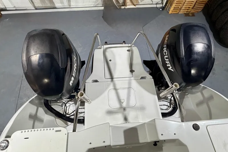Slide: The Image of 2006 Glacier Bay 2640SX Renegade boat with dual Mercury outboard engines. - 11
