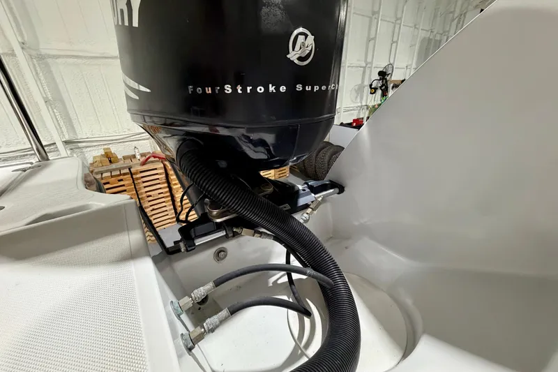 Slide: The Image of Close-up of a 2006 Glacier Bay 2640SX Renegade boat engine, featuring a FourStroke Supercharged motor. - 13
