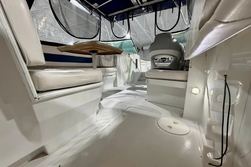 Slide: The Image of Interior of 2006 Glacier Bay 2640SX Renegade boat with seating and table. - 21