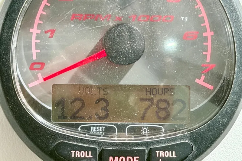 Slide: The Image of Close-up of a 2006 Glacier Bay 2640SX Renegade tachometer displaying RPM and engine hours. - 24