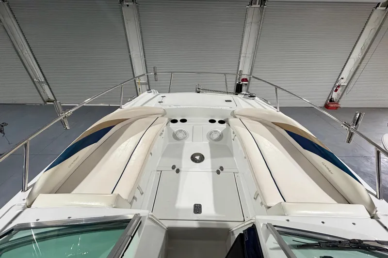 Slide: The Image of 2006 Glacier Bay 2640SX Renegade boat interior with white seating and metal railings. - 26