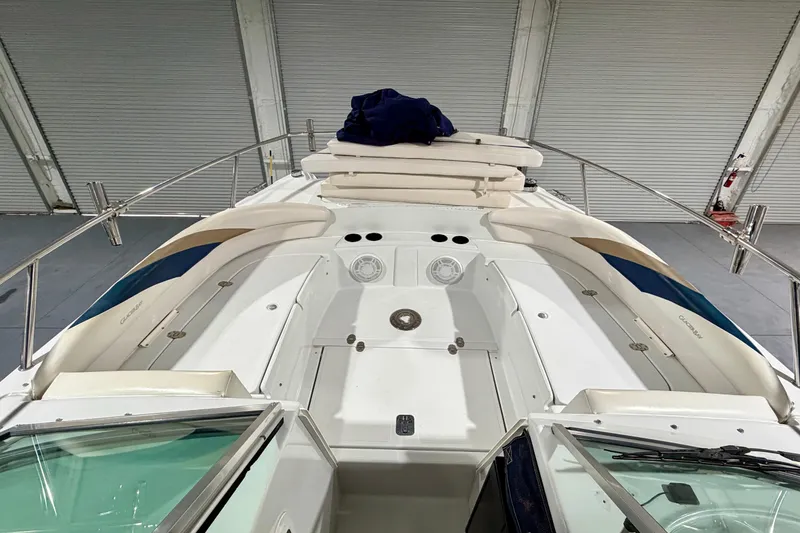 Slide: The Image of 2006 Glacier Bay 2640SX Renegade boat interior with cushioned seating and storage compartments. - 28