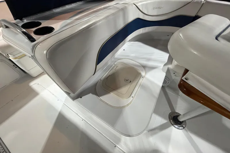 Slide: The Image of Interior seating of 2006 Glacier Bay 2640SX Renegade boat with cup holders. - 31
