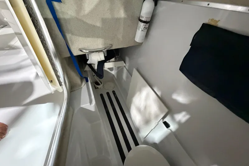 Slide: The Image of Interior of 2006 Glacier Bay 2640SX Renegade boat, featuring compact cabin space. - 34