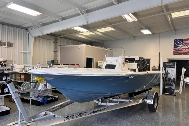 The Image of 2026 Tidewater 1910 Bay Max boat displayed in showroom on trailer. - 0