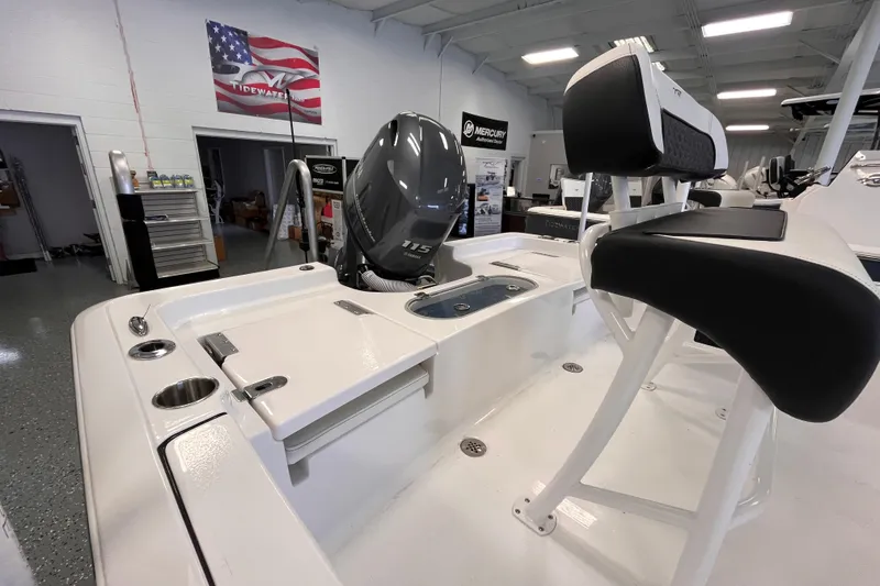 Slide: The Image of 2026 Tidewater 1910 Bay Max boat interior with Yamaha 115 engine in showroom. - 3