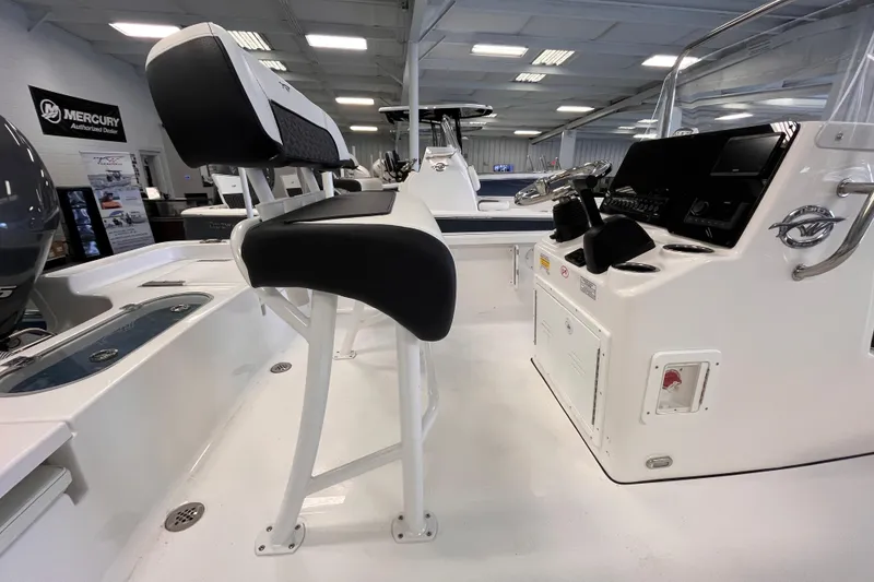 Slide: The Image of 2026 Tidewater 1910 Bay Max boat interior with seating and control panel. - 4