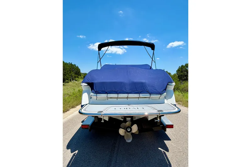 Slide: The Image of 2013 Cobalt 262 boat with blue cover on a sunny day. - 10