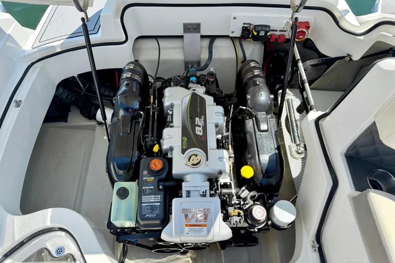 Slide: The Image of Engine compartment of a 2013 Cobalt 262 boat, featuring a powerful V8 engine. - 21
