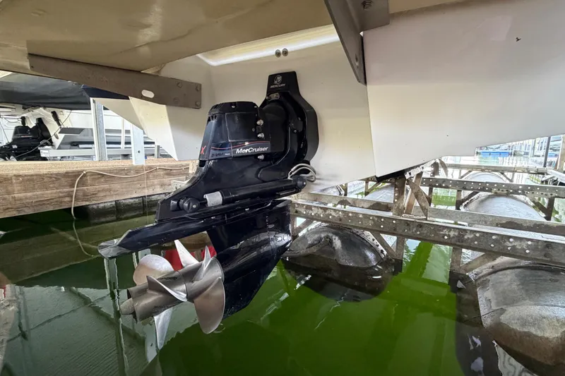 Slide: The Image of 2013 Cobalt 262 boat with MerCruiser outdrive in marina setting. - 22