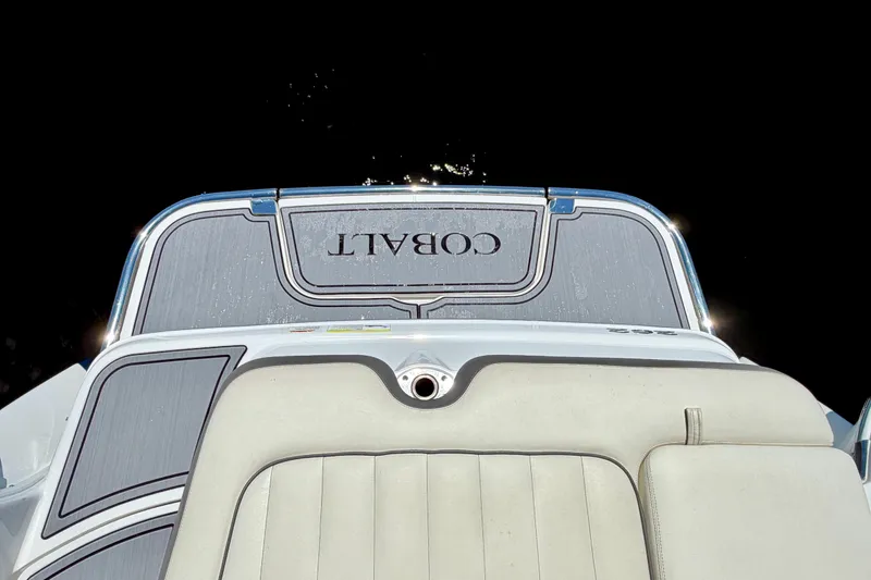 Slide: The Image of Rear view of 2013 Cobalt 262 boat with cushioned seating and logo. - 23