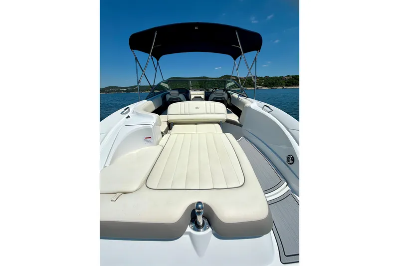 Slide: The Image of 2013 Cobalt 262 boat with sunpad, canopy, and scenic water view. - 24