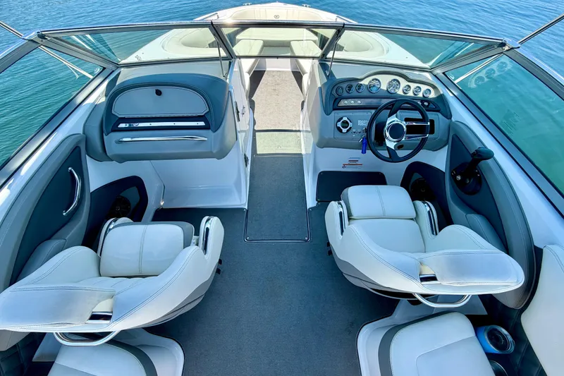 Slide: The Image of Interior of a 2013 Cobalt 262 boat with modern dashboard and seating. - 28