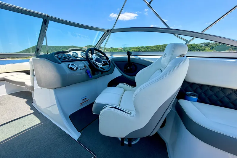 Slide: The Image of Interior of a 2013 Cobalt 262 boat with steering wheel and dashboard. - 29
