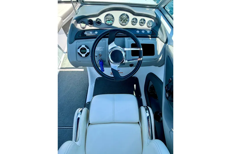 Slide: The Image of Steering console of a 2013 Cobalt 262 boat with gauges and controls. - 30