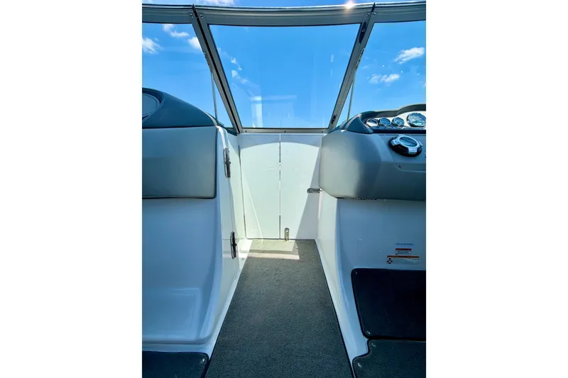 Slide: The Image of Interior view of 2013 Cobalt 262 boat cockpit with clear windshield and dashboard. - 32