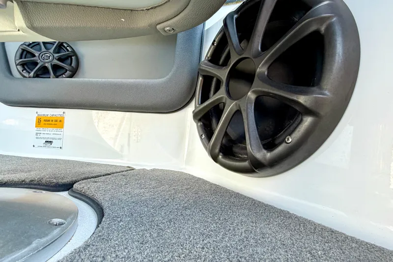 Slide: The Image of Interior of 2013 Cobalt 262 boat featuring speakers and carpeted flooring. - 36
