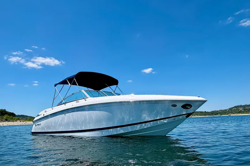 Slide: The Image of 2013 Cobalt 262 boat on clear blue water under sunny sky. - 6