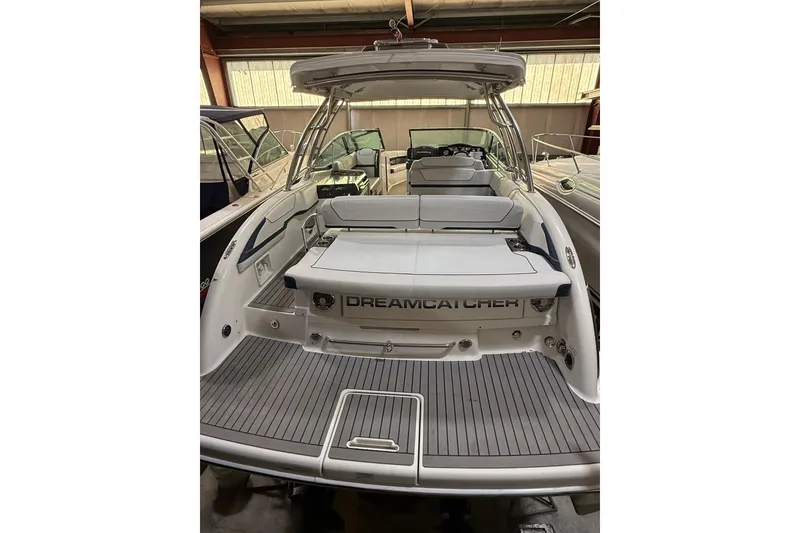 Slide: The Image of 2016 Formula 350 Crossover Bowrider boat in storage, featuring spacious seating and sleek design. - 12