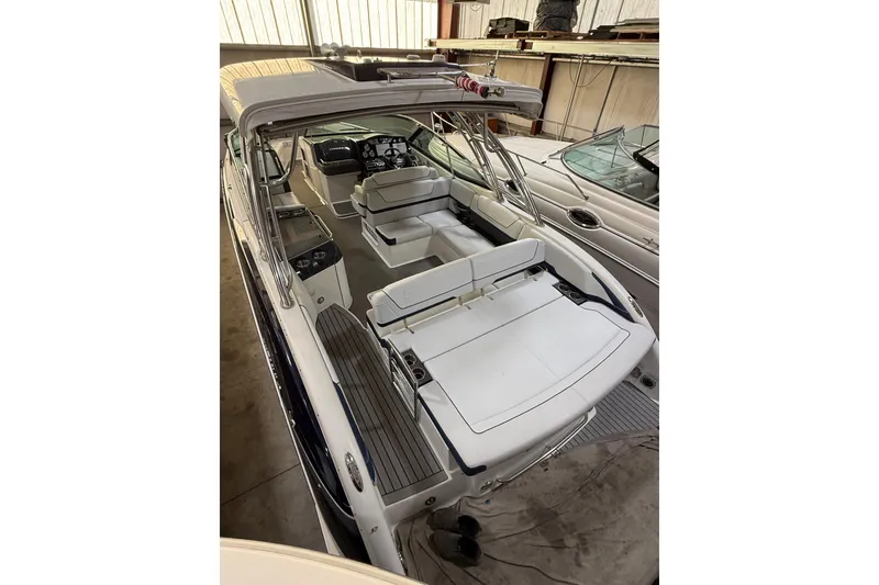 Slide: The Image of 2016 Formula 350 Crossover Bowrider in storage, showcasing spacious seating and sleek design. - 14