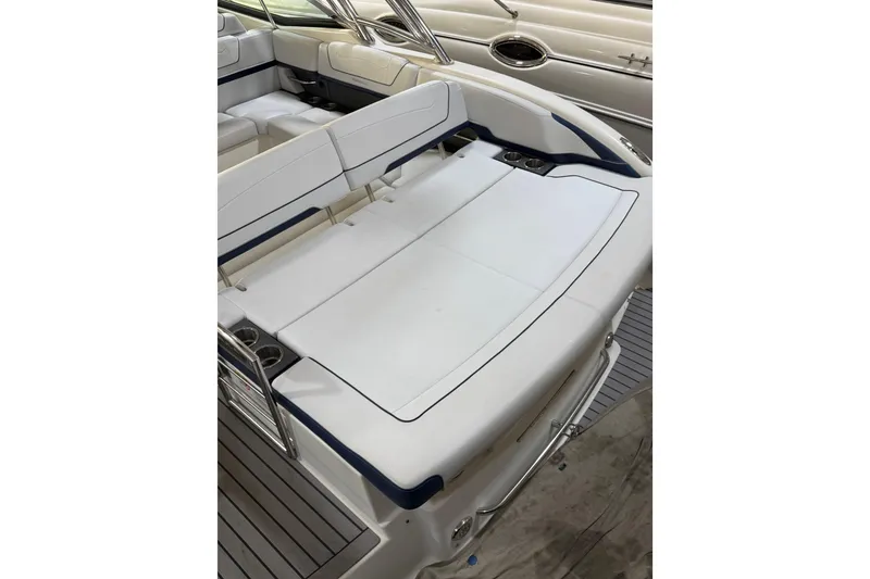 Slide: The Image of 2016 Formula 350 Crossover Bowrider interior with white seating and cup holders. - 15