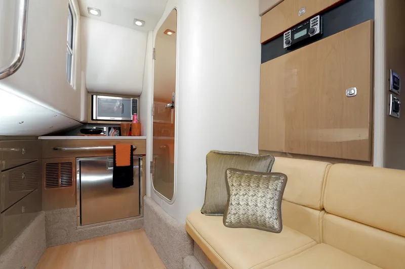 Slide: The Image of Manufacturer Provided Image: Interior of 2016 Formula 350 Crossover Bowrider with kitchenette and seating area. - 19