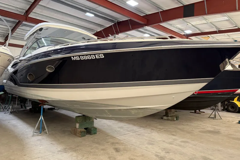 Slide: The Image of 2016 Formula 350 Crossover Bowrider in storage, showcasing sleek design and modern features. - 2