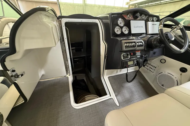 Slide: The Image of 2016 Formula 350 Crossover Bowrider cockpit with open cabin door and navigation equipment. - 23